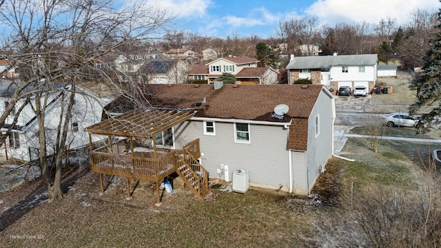 back of house with a wooden deck