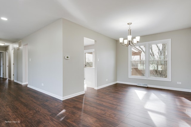 unfurnished dining area with a chandelier and dark wood-type flooring