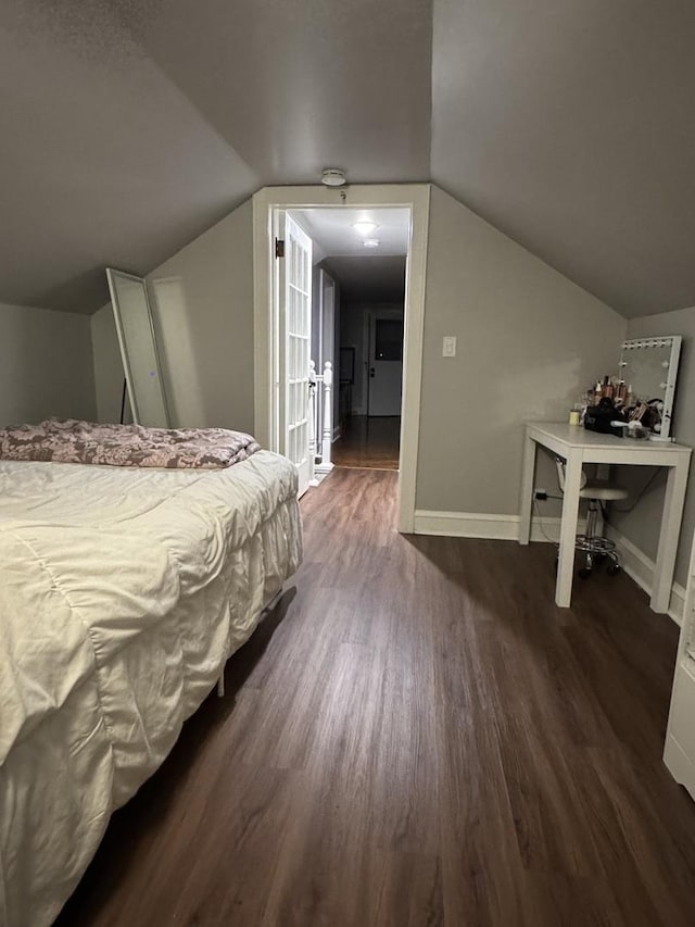 1907 S 49th Ct, Cicero, IL 60804 - bedroom featuring vaulted ceiling, baseboards, and dark wood-style flooring