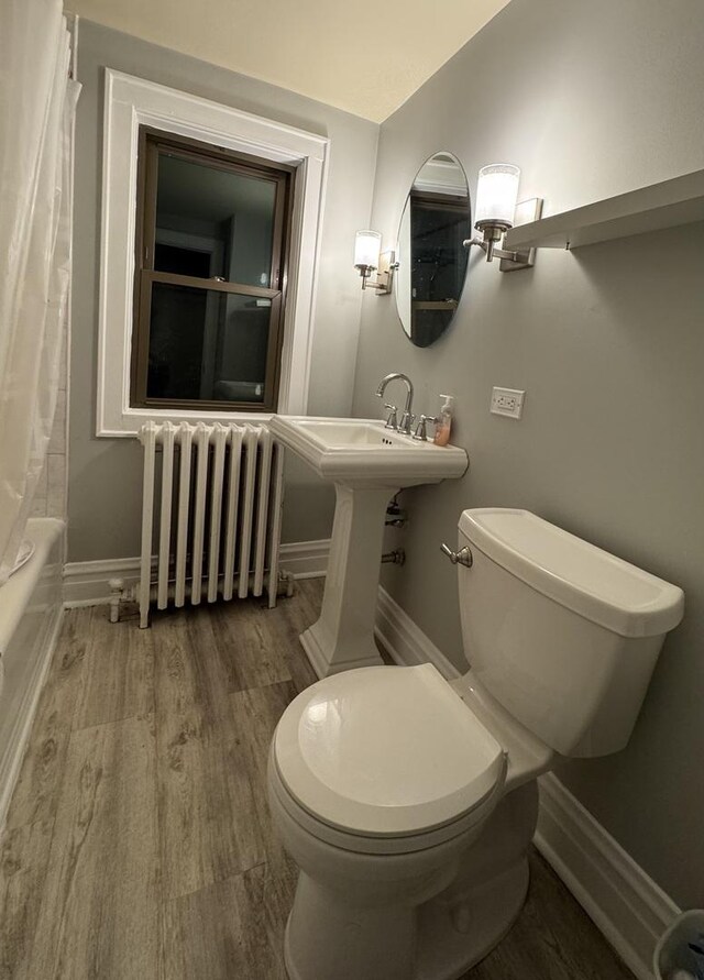 1907 S 49th Ct, Cicero, IL 60804 - full bath with radiator, baseboards, toilet, shower / tub combo with curtain, and wood finished floors