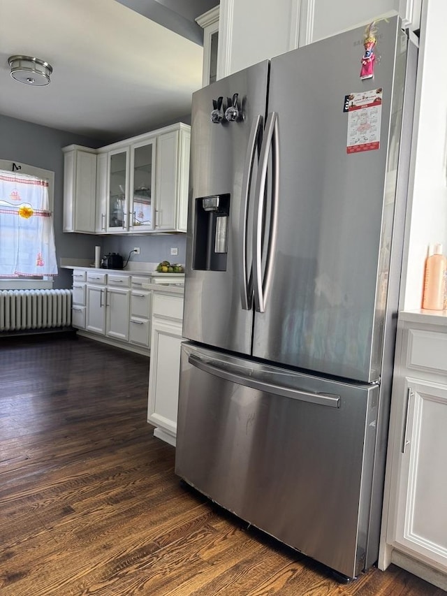 1907 S 49th Ct, Cicero, IL 60804 - kitchen with dark wood finished floors, radiator heating unit, white cabinetry, stainless steel fridge with ice dispenser, and glass insert cabinets