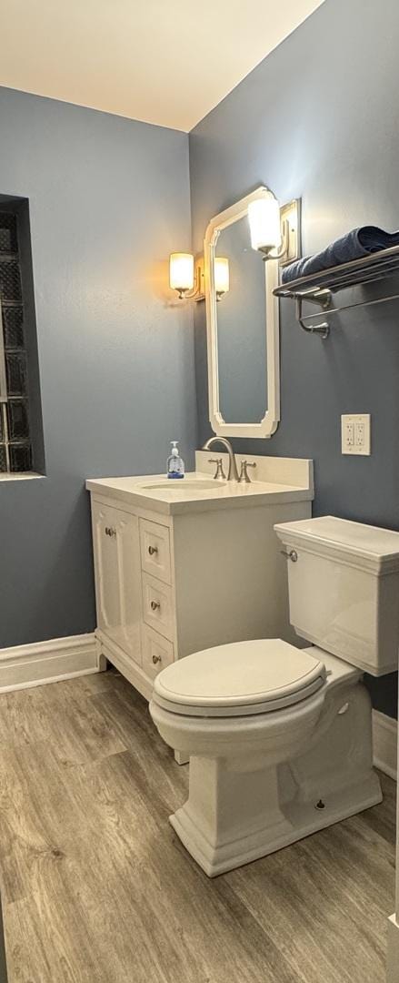 1907 S 49th Ct, Cicero, IL 60804 - bathroom featuring baseboards, toilet, and wood finished floors