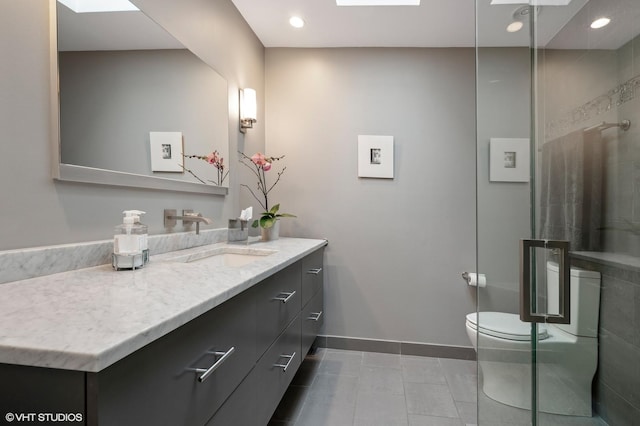 bathroom featuring baseboards, toilet, tile patterned floors, vanity, and recessed lighting