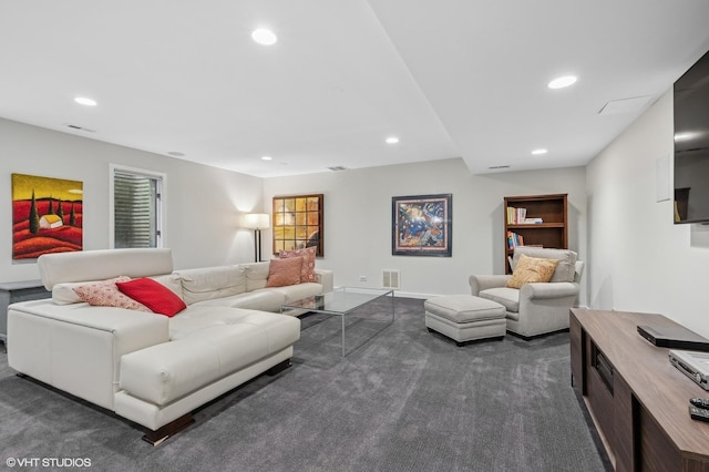 living room featuring dark carpet and recessed lighting