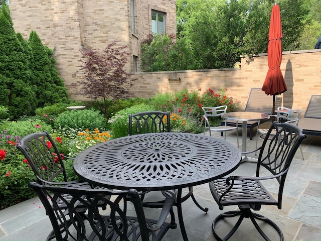 view of patio / terrace with outdoor dining space and fence