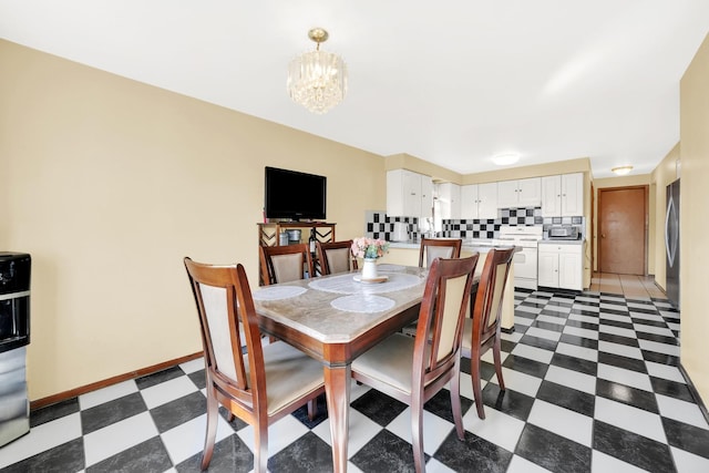 dining area featuring a notable chandelier