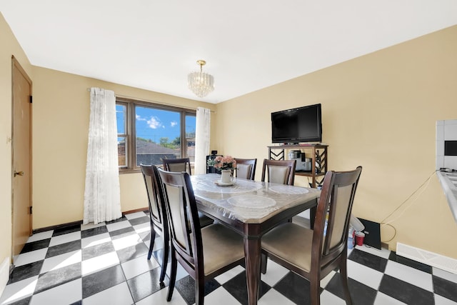 dining space featuring a chandelier