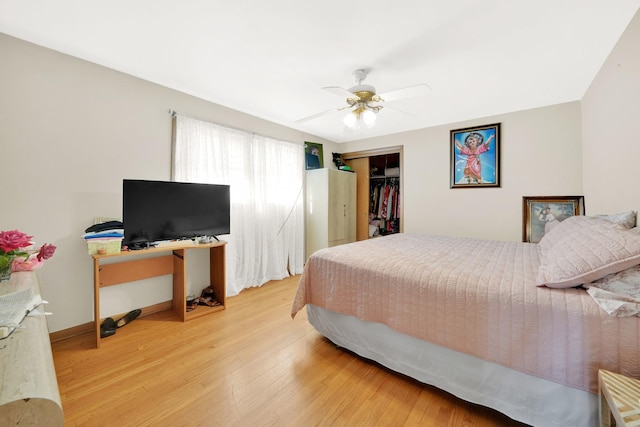 bedroom featuring a closet, hardwood / wood-style flooring, and ceiling fan