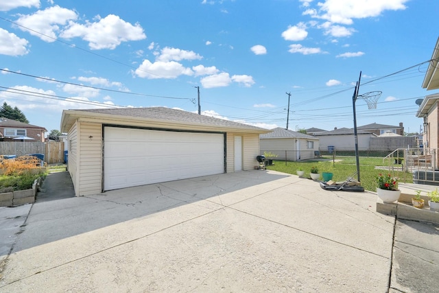 garage featuring a lawn