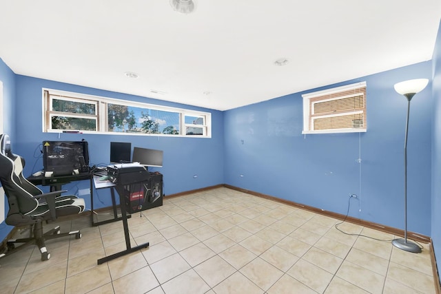 unfurnished office featuring light tile patterned floors