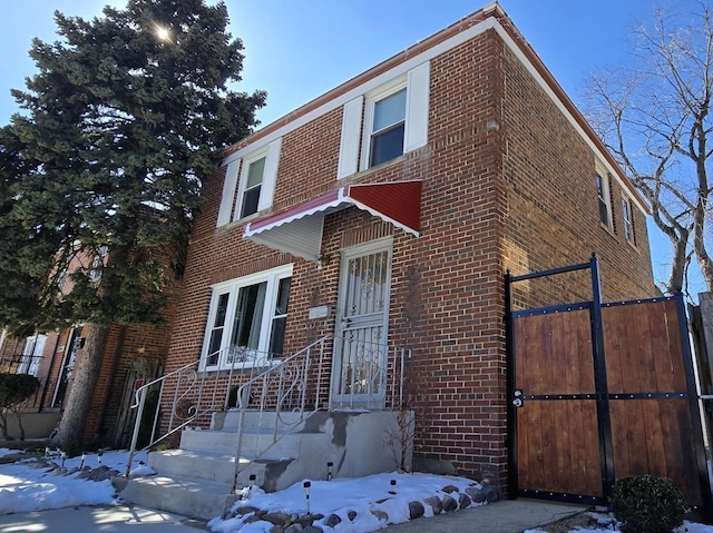 view of front of property featuring brick siding