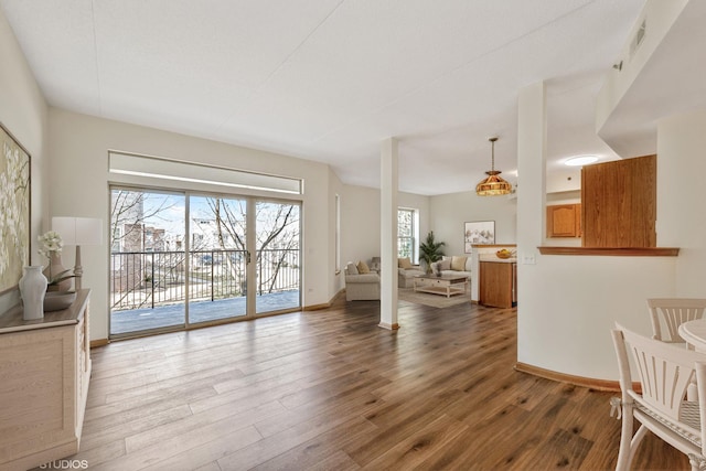 living room featuring baseboards and wood finished floors