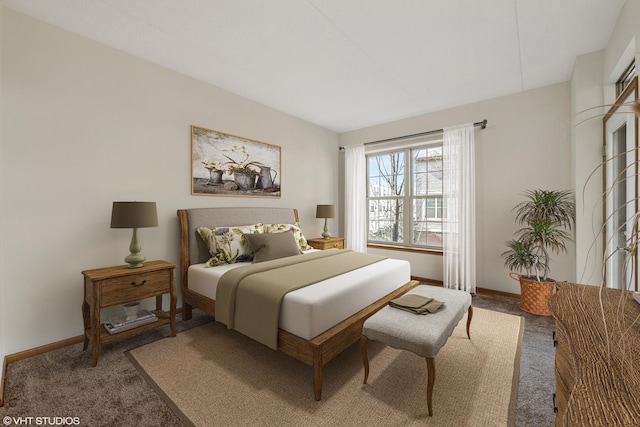 carpeted bedroom featuring baseboards