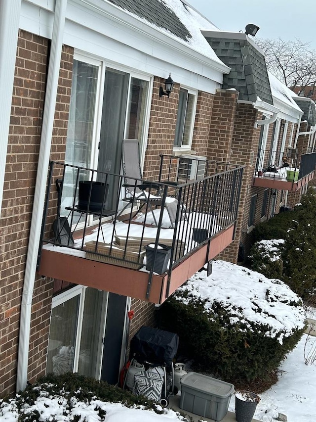 snow covered deck with grilling area