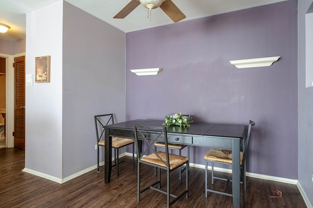 dining space featuring ceiling fan, wood finished floors, and baseboards