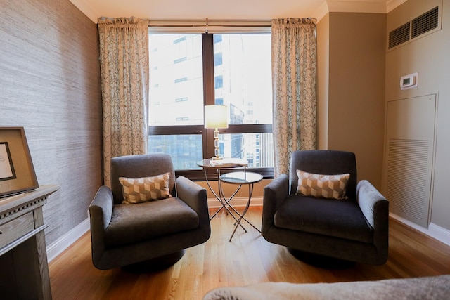 living area with light hardwood / wood-style floors and plenty of natural light