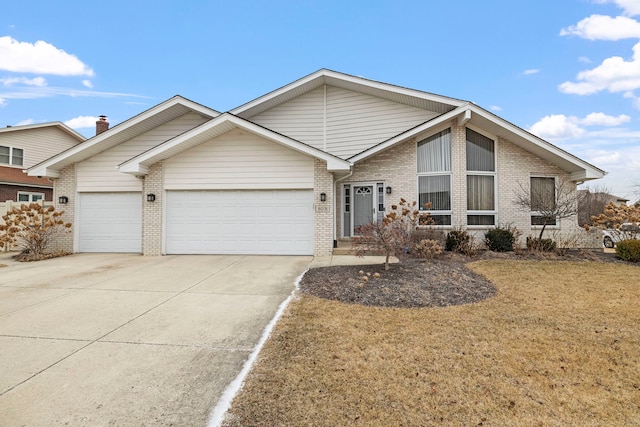 view of front of home with a front lawn and a garage