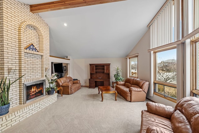 carpeted living room with high vaulted ceiling, a brick fireplace, and beam ceiling