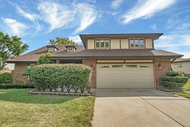 view of front facade featuring a front yard and a garage