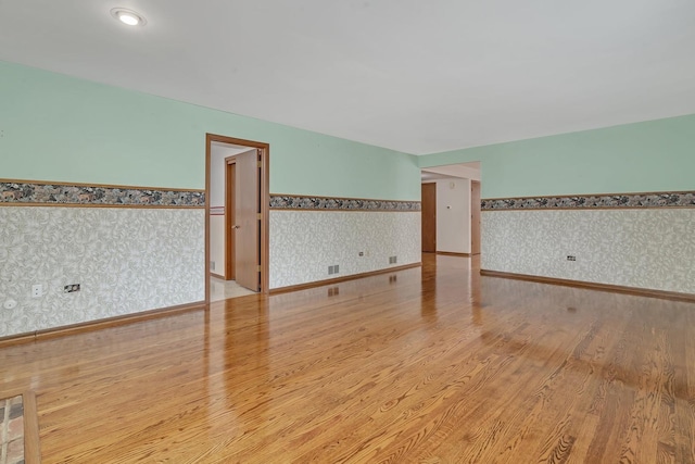 spare room featuring light hardwood / wood-style floors