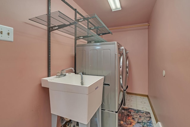 washroom featuring sink and separate washer and dryer