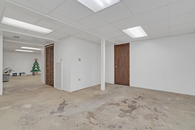 basement featuring a paneled ceiling