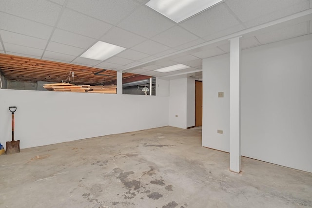 basement featuring a drop ceiling