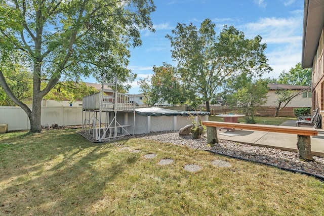 view of yard featuring a pool side deck