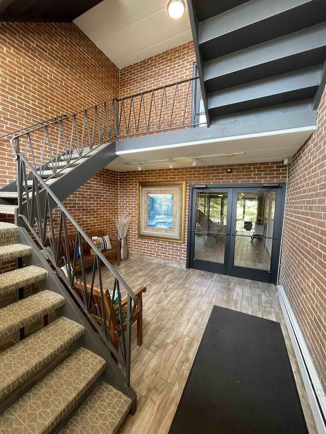 property entrance featuring french doors and baseboard heating