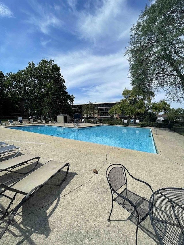 view of swimming pool with a patio area