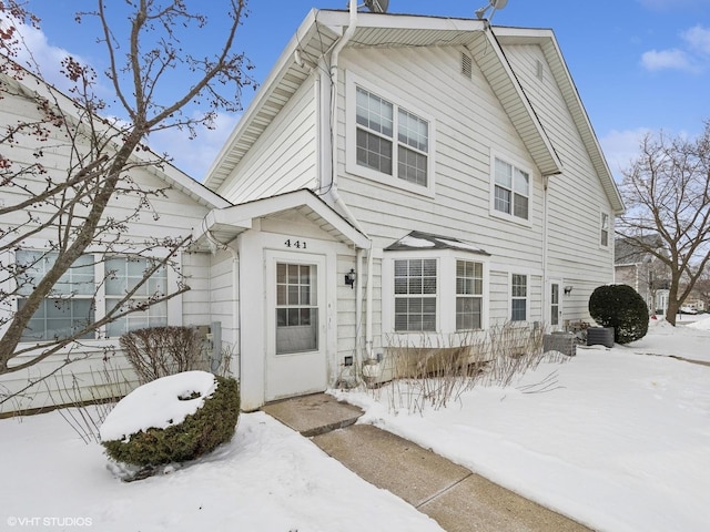 view of snow covered house