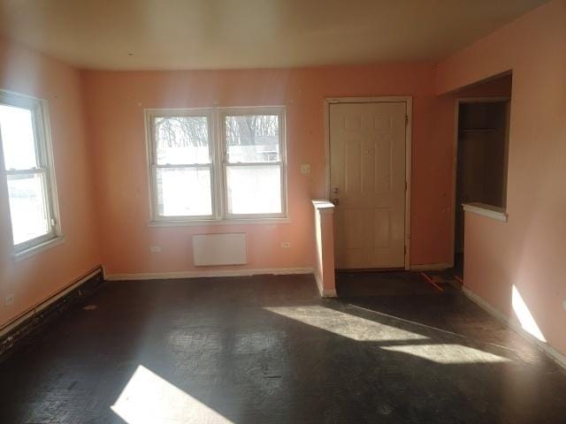 unfurnished room featuring baseboards