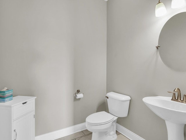 5 Fieldcrest Dr, Monticello, IL 61856 - bathroom featuring toilet, baseboards, tile patterned floors, and a sink