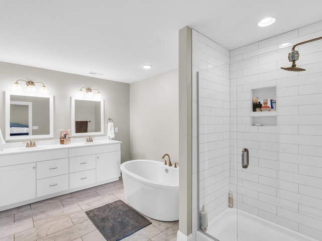 5 Fieldcrest Dr, Monticello, IL 61856 - full bathroom with a stall shower, a freestanding bath, marble finish flooring, double vanity, and recessed lighting