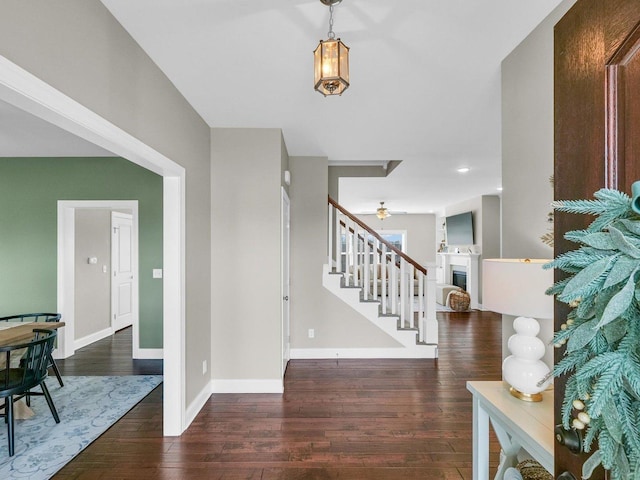5 Fieldcrest Dr, Monticello, IL 61856 - entrance foyer with stairs, wood finished floors, baseboards, a fireplace, and ceiling fan