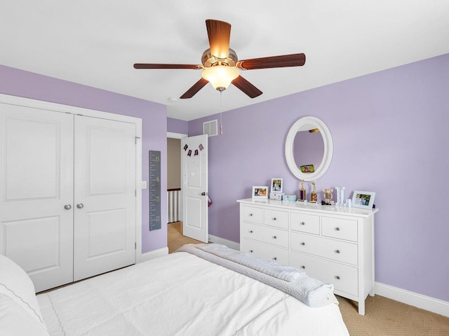 5 Fieldcrest Dr, Monticello, IL 61856 - bedroom with light carpet, baseboards, a closet, and ceiling fan