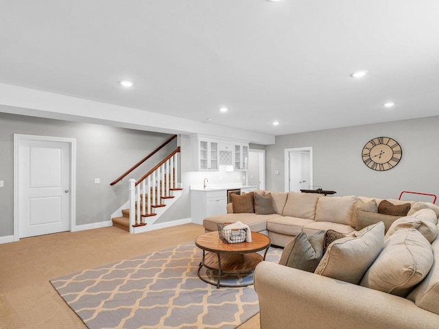 5 Fieldcrest Dr, Monticello, IL 61856 - living area featuring bar with sink, recessed lighting, light colored carpet, stairs, and baseboards