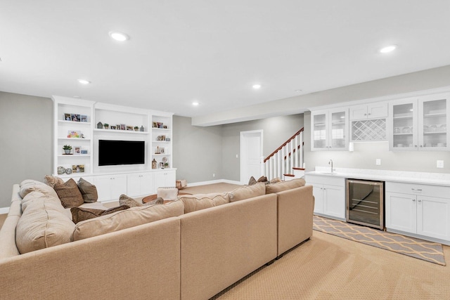 5 Fieldcrest Dr, Monticello, IL 61856 - living room with wine cooler, wet bar, recessed lighting, light colored carpet, and baseboards