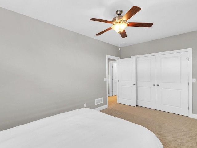 5 Fieldcrest Dr, Monticello, IL 61856 - bedroom featuring light colored carpet, baseboards, a closet, and a ceiling fan