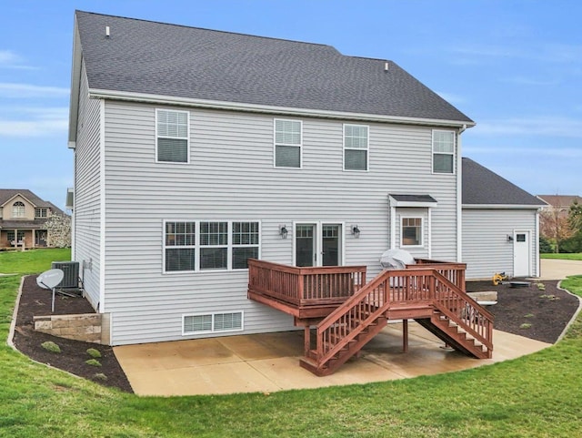 5 Fieldcrest Dr, Monticello, IL 61856 - back of property featuring stairway, a deck, a patio area, a lawn, and a shingled roof