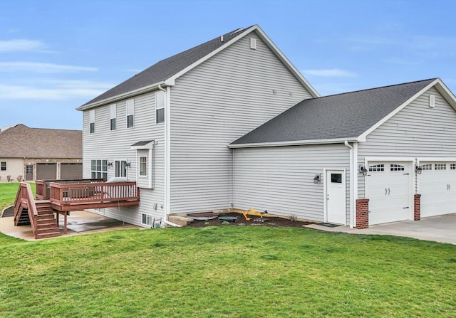 5 Fieldcrest Dr, Monticello, IL 61856 - back of house with an attached garage, a wooden deck, a yard, and concrete driveway