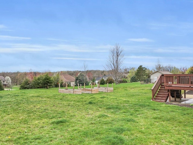 5 Fieldcrest Dr, Monticello, IL 61856 - view of grassy yard featuring a garden, a deck, and stairway