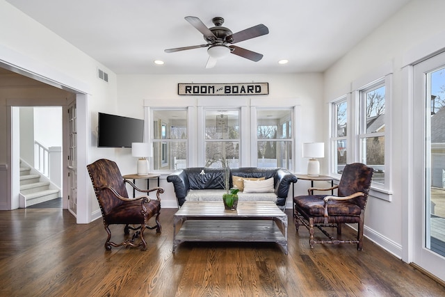 interior space featuring a ceiling fan and visible vents