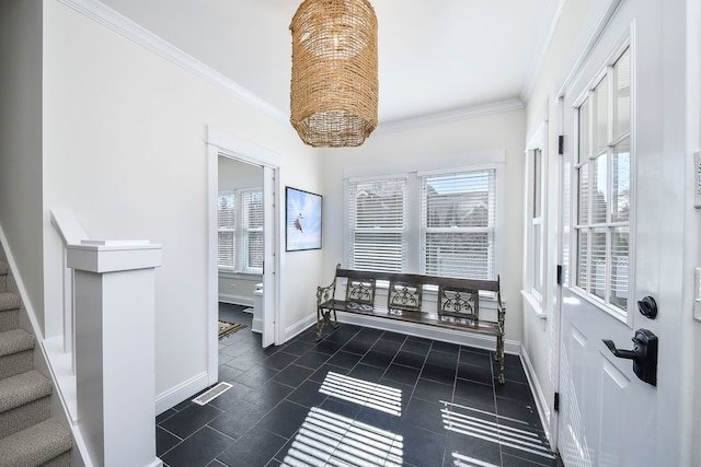 interior space featuring baseboards, stairway, a wealth of natural light, and crown molding