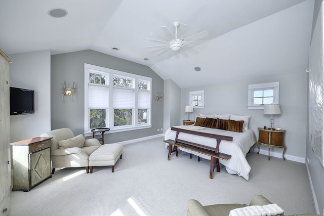 carpeted bedroom featuring lofted ceiling, ceiling fan, and baseboards