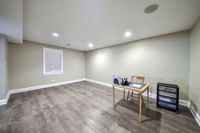 office space featuring baseboards, wood finished floors, and recessed lighting