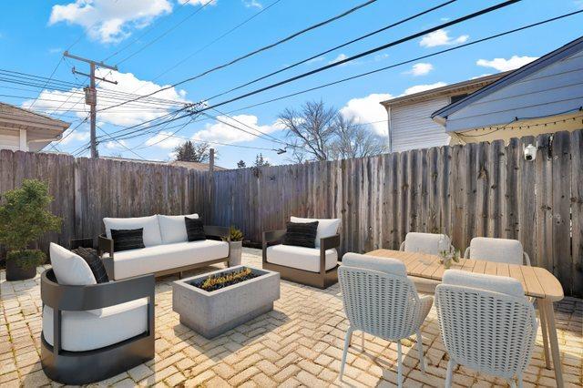 view of patio / terrace with a fenced backyard and an outdoor living space