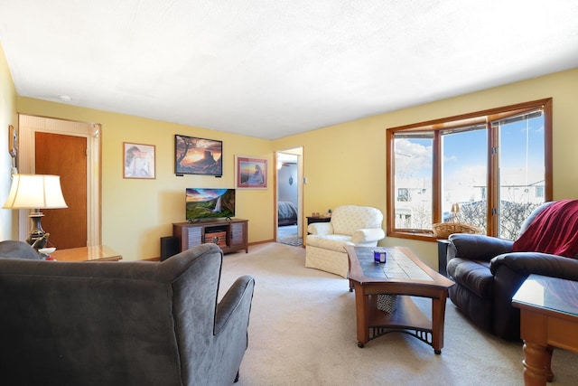 living area with light colored carpet