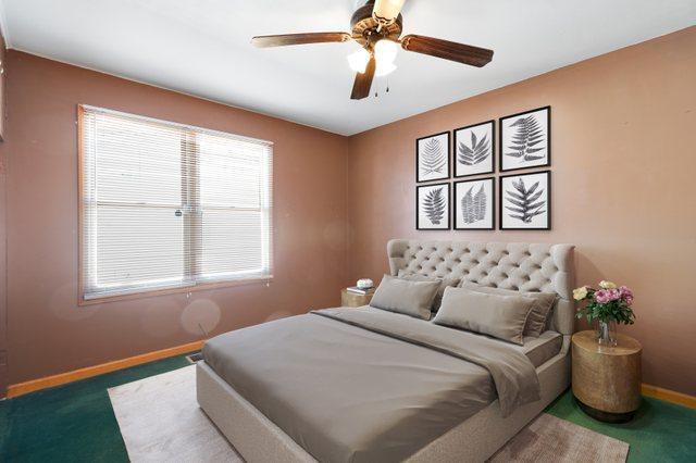 carpeted bedroom with baseboards and a ceiling fan