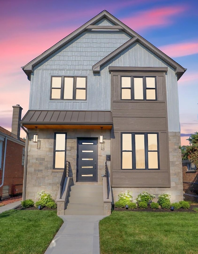 view of front of house with a yard